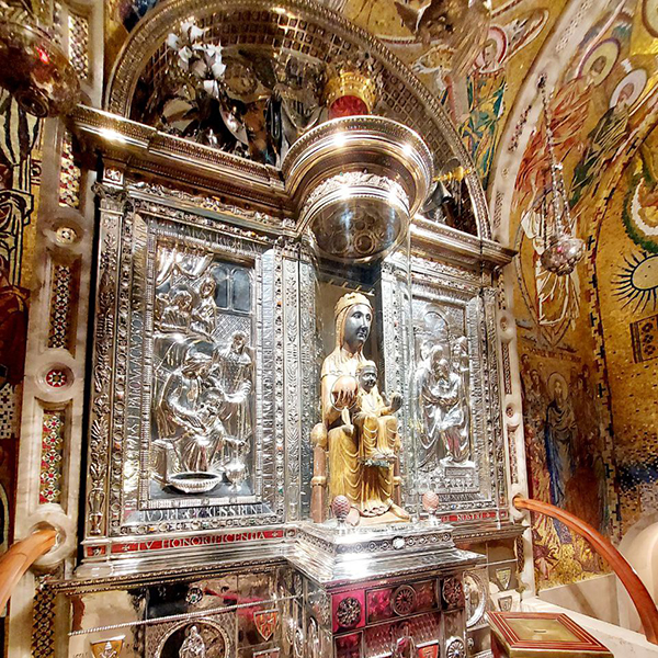 Close-up of the Black Madonna of Montserrat, a revered religious statue inside the basilica