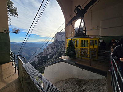 Montserrat Aeri cable car station with the steep mountain ascent in the background