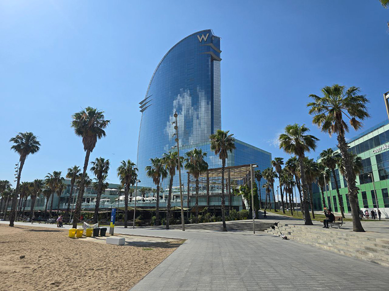 Hotel W in Barcelona with palm trees around
