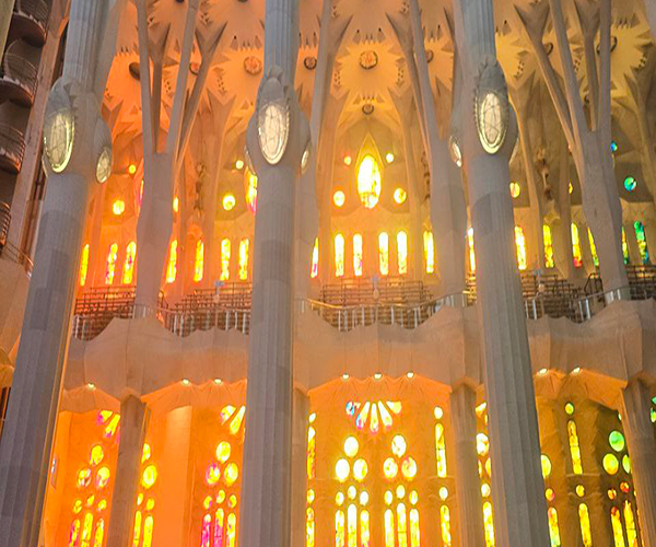 Sagrada Familia's stained glass windows - colorful light patterns inside the basilica