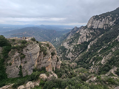Distant view of Montserrat, featuring the Santa Cova Chapel in the cliffs